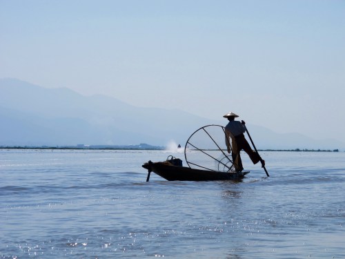 Traditional way of fishing uses one leg with hands free to catch fish using a basket net. 